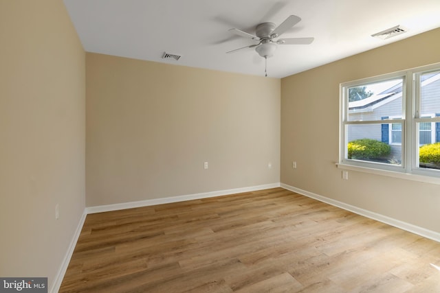 spare room with light hardwood / wood-style flooring and ceiling fan