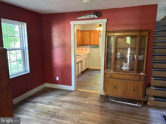 unfurnished dining area with dark hardwood / wood-style flooring