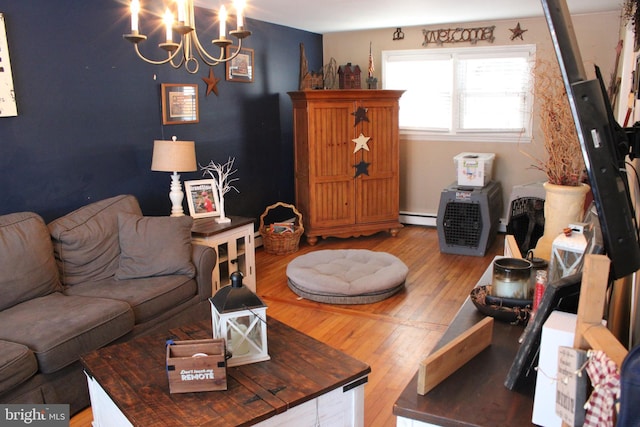 living room with baseboard heating, a chandelier, and hardwood / wood-style flooring