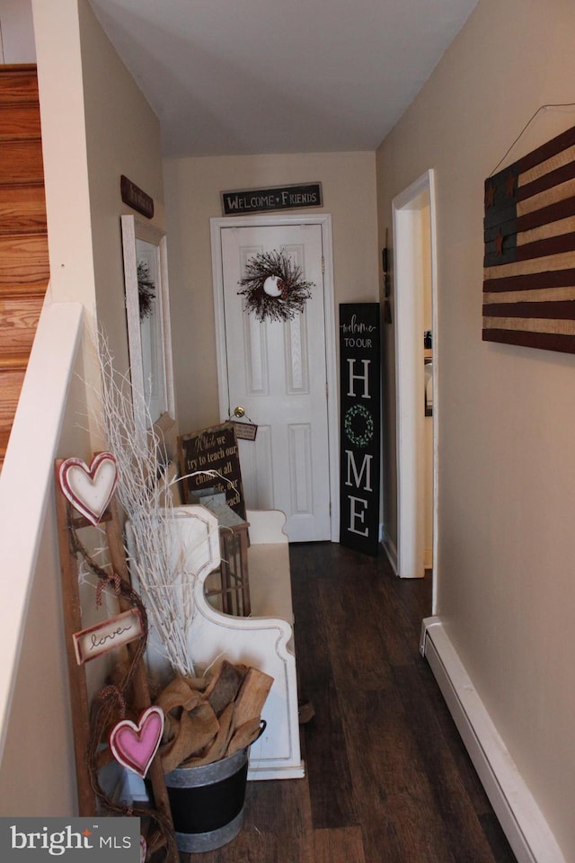 hallway featuring a baseboard radiator and dark hardwood / wood-style floors