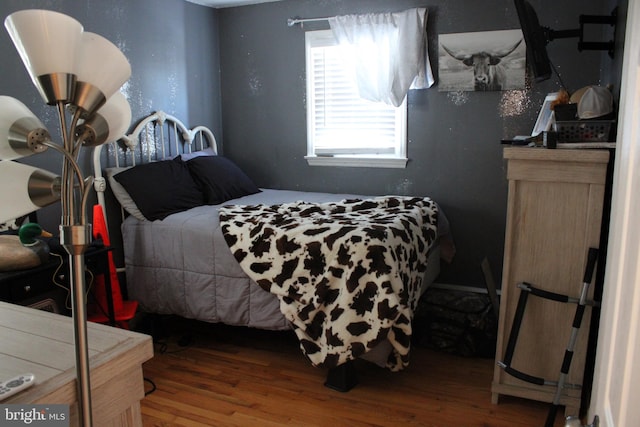 bedroom featuring hardwood / wood-style flooring