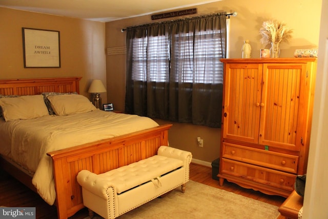 bedroom with wood-type flooring