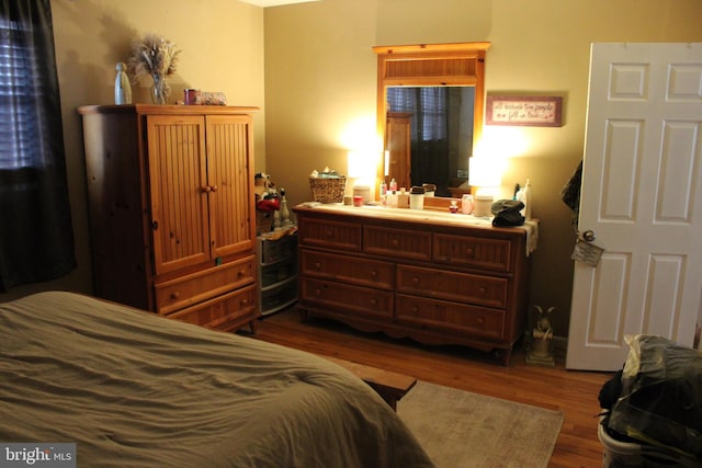 bedroom featuring wood-type flooring