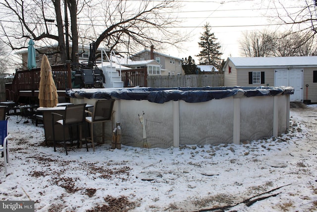 view of snow covered pool