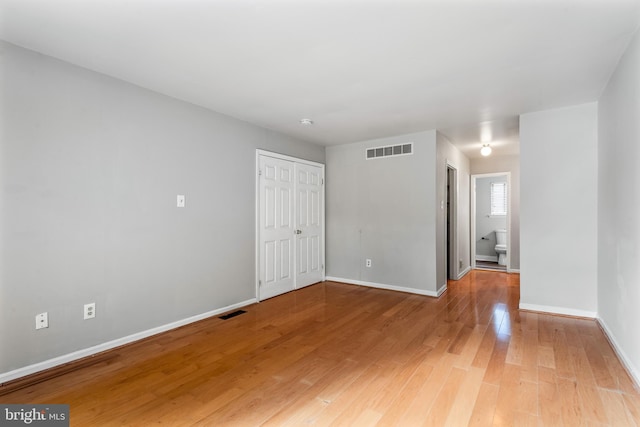 empty room featuring wood-type flooring