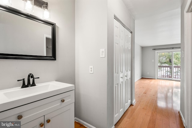 bathroom featuring hardwood / wood-style floors and vanity