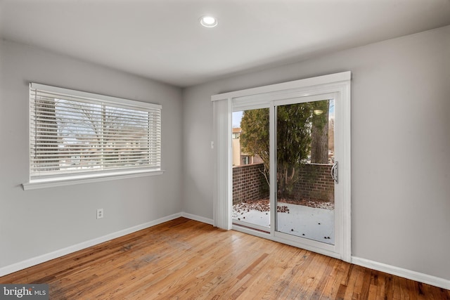 spare room featuring light hardwood / wood-style floors