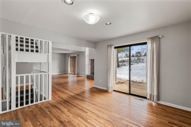 empty room featuring wood-type flooring