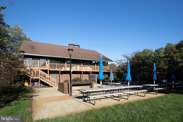 exterior space featuring stairs and a patio