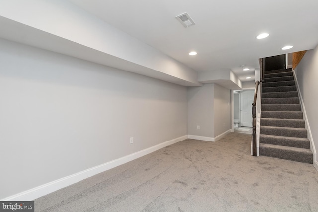 basement with light colored carpet