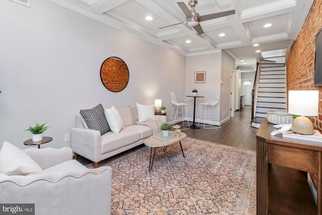 living room featuring coffered ceiling, crown molding, beamed ceiling, ceiling fan, and dark wood-type flooring