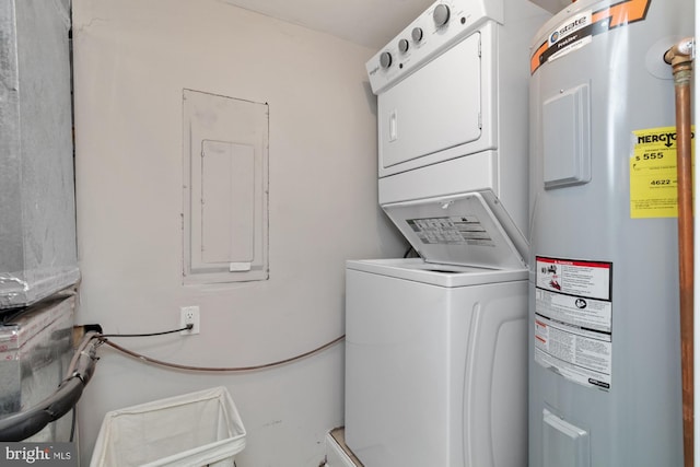 washroom with stacked washer / drying machine, electric water heater, and electric panel