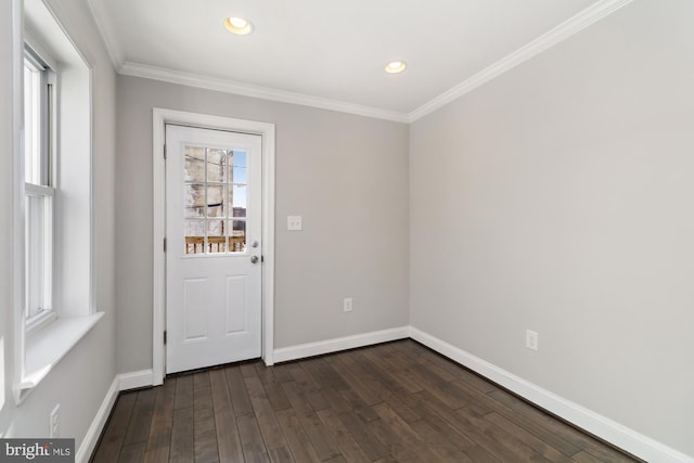 entryway featuring ornamental molding and dark hardwood / wood-style flooring