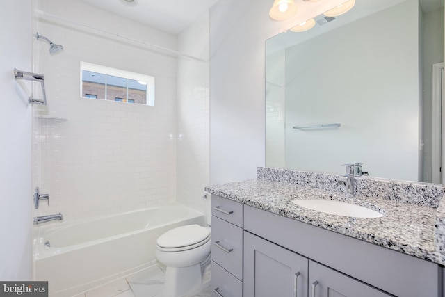 full bathroom featuring vanity, tiled shower / bath combo, and toilet