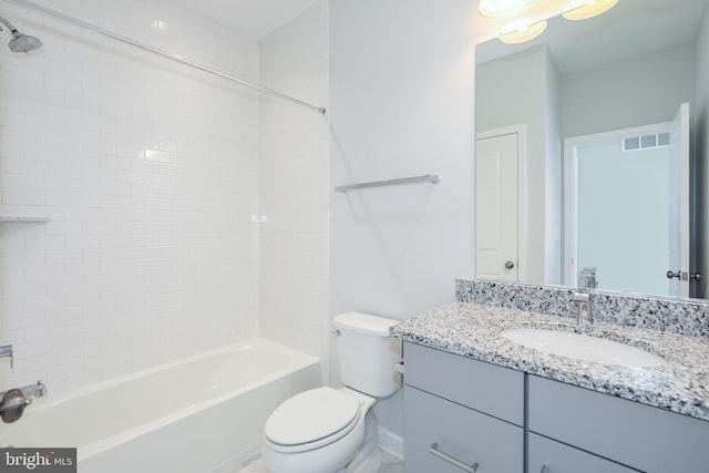 full bathroom with washtub / shower combination, vanity, and toilet