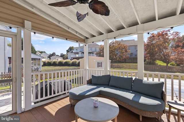 wooden terrace featuring an outdoor living space