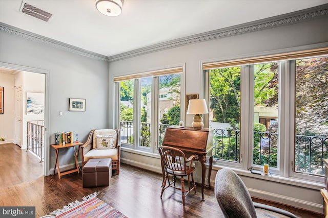 living area with dark wood-type flooring and crown molding