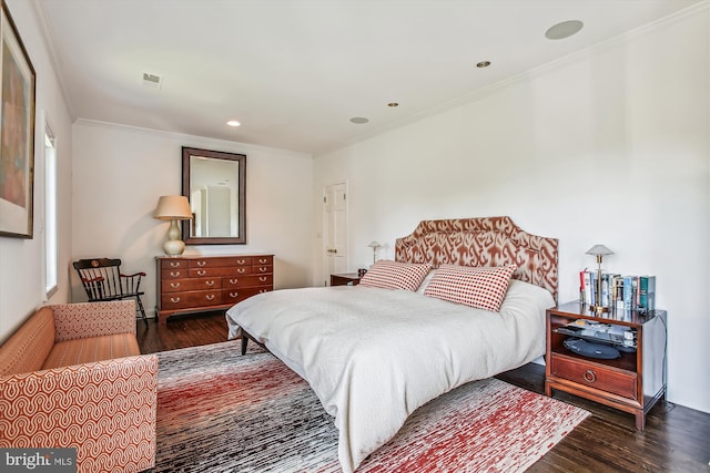 bedroom featuring dark hardwood / wood-style floors and crown molding