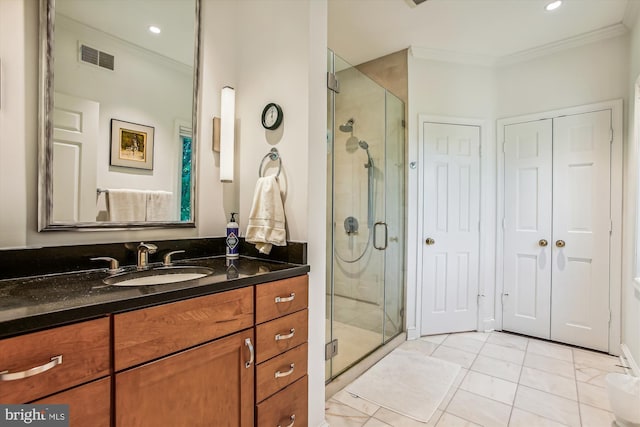 bathroom with walk in shower, tile patterned floors, vanity, and ornamental molding