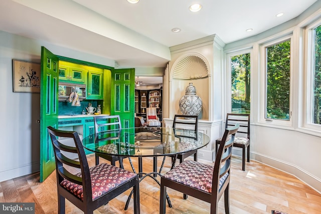 dining space with hardwood / wood-style floors