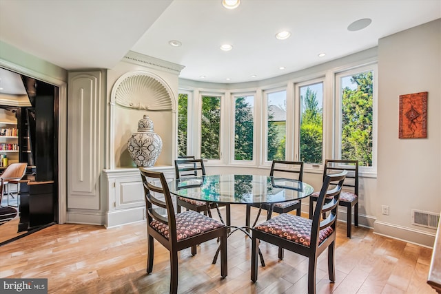 dining area with light hardwood / wood-style flooring