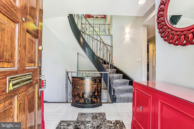 entrance foyer with light tile patterned floors