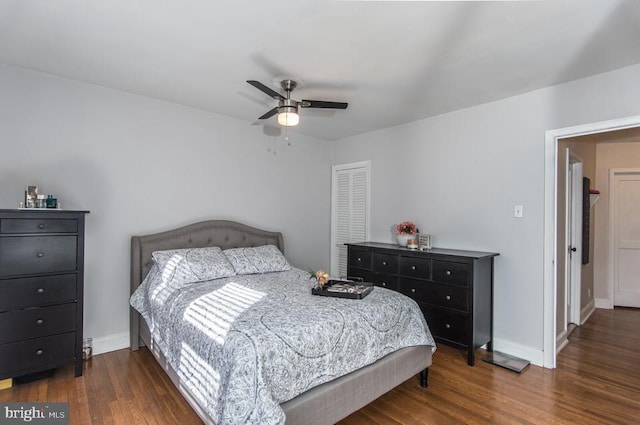 bedroom with ceiling fan and dark hardwood / wood-style floors