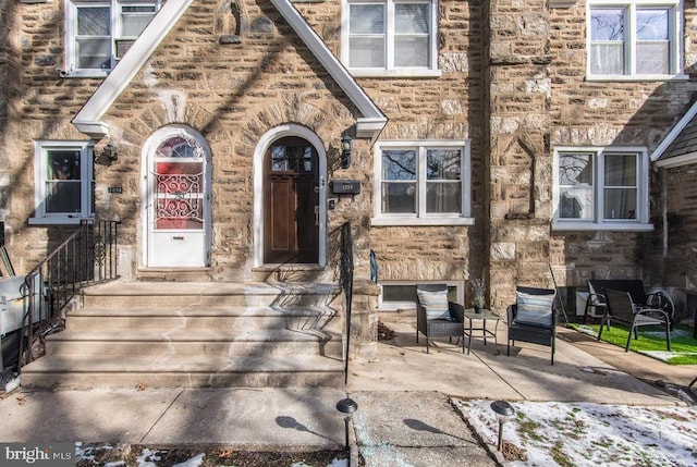 entrance to property with a patio