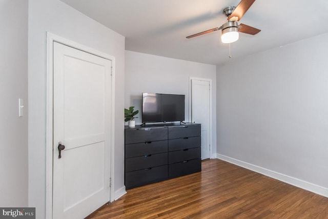 bedroom featuring dark wood-type flooring and ceiling fan