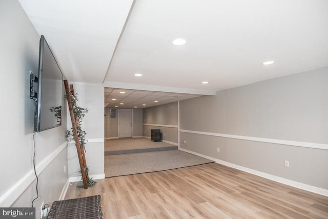 basement featuring light hardwood / wood-style flooring