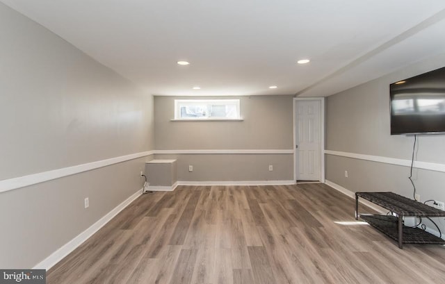 basement with wood-type flooring