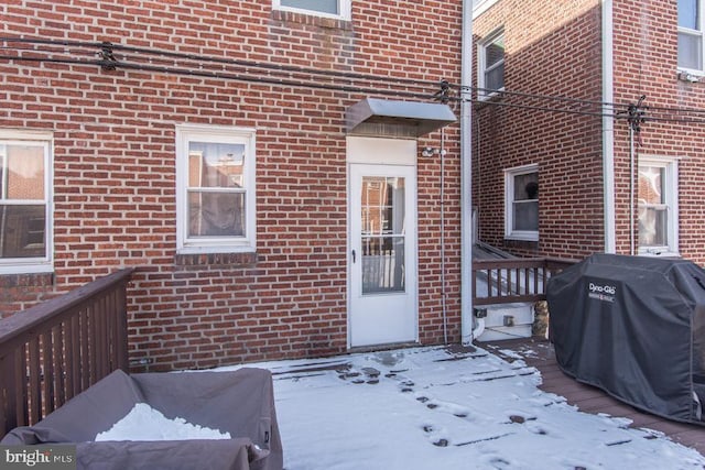 view of snow covered property entrance