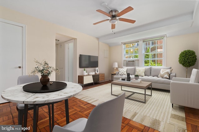 living room with ceiling fan and parquet flooring