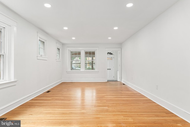 unfurnished room featuring light wood-type flooring