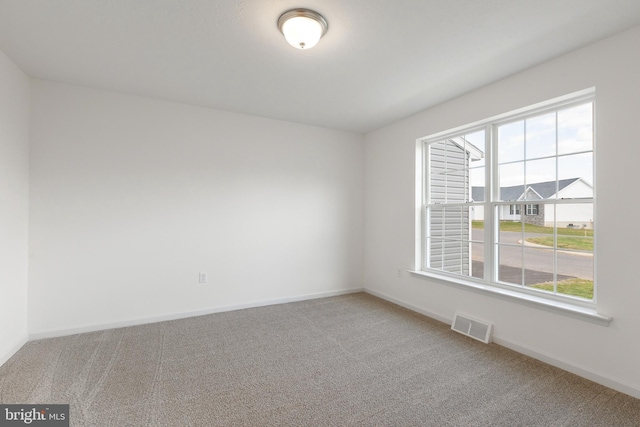 view of carpeted spare room