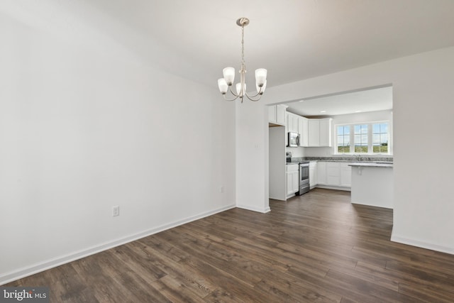 interior space featuring a notable chandelier, dark hardwood / wood-style flooring, and sink