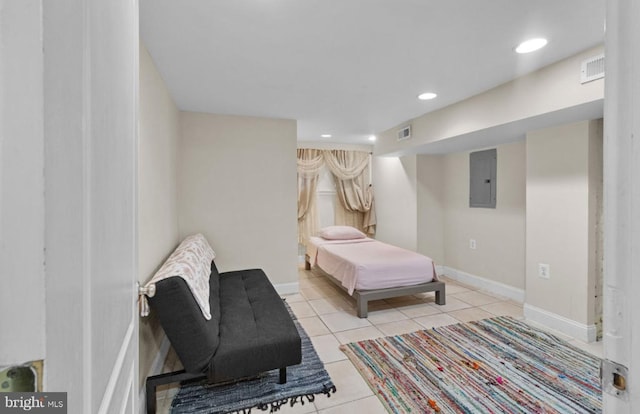 tiled bedroom featuring electric panel