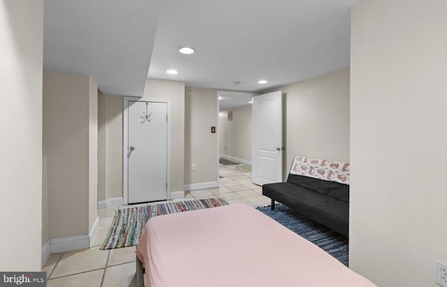 bedroom with light tile patterned floors