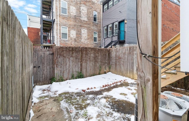 view of yard covered in snow