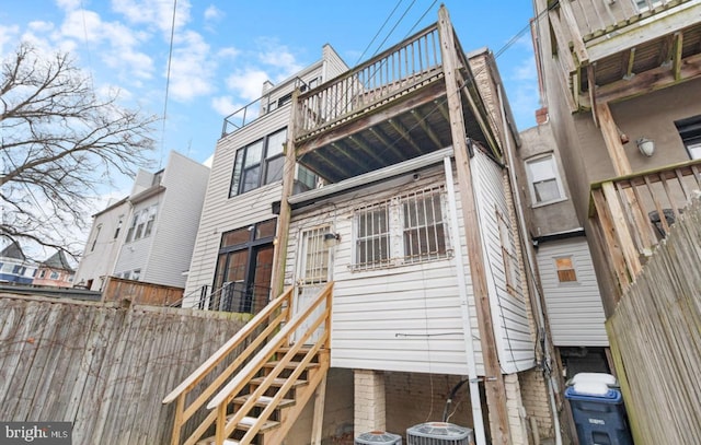 back of house featuring central air condition unit