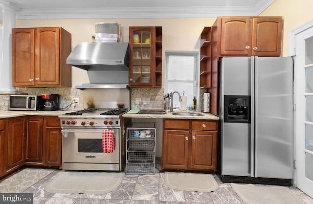 kitchen featuring tasteful backsplash, sink, stainless steel appliances, and ornamental molding