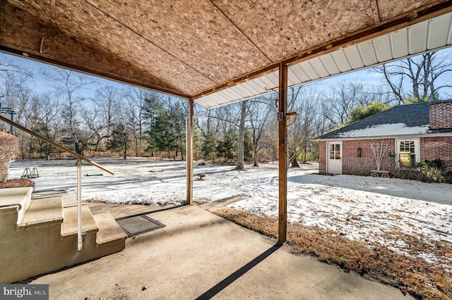 view of snow covered patio