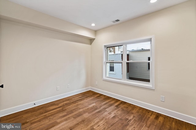 spare room featuring hardwood / wood-style floors