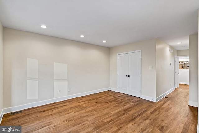 spare room featuring hardwood / wood-style floors