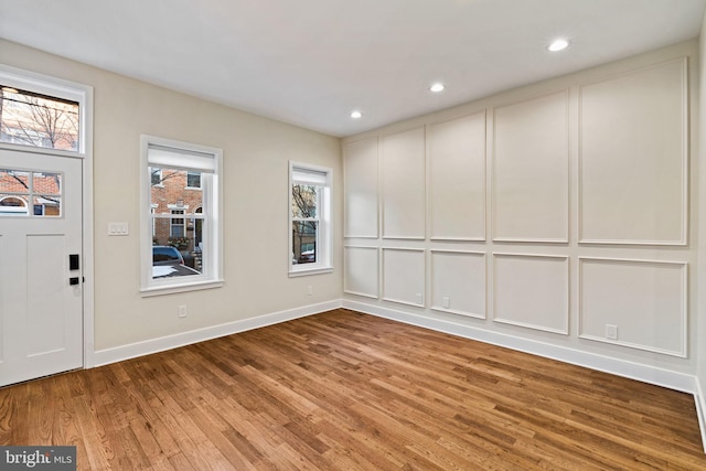 unfurnished room with wood-type flooring