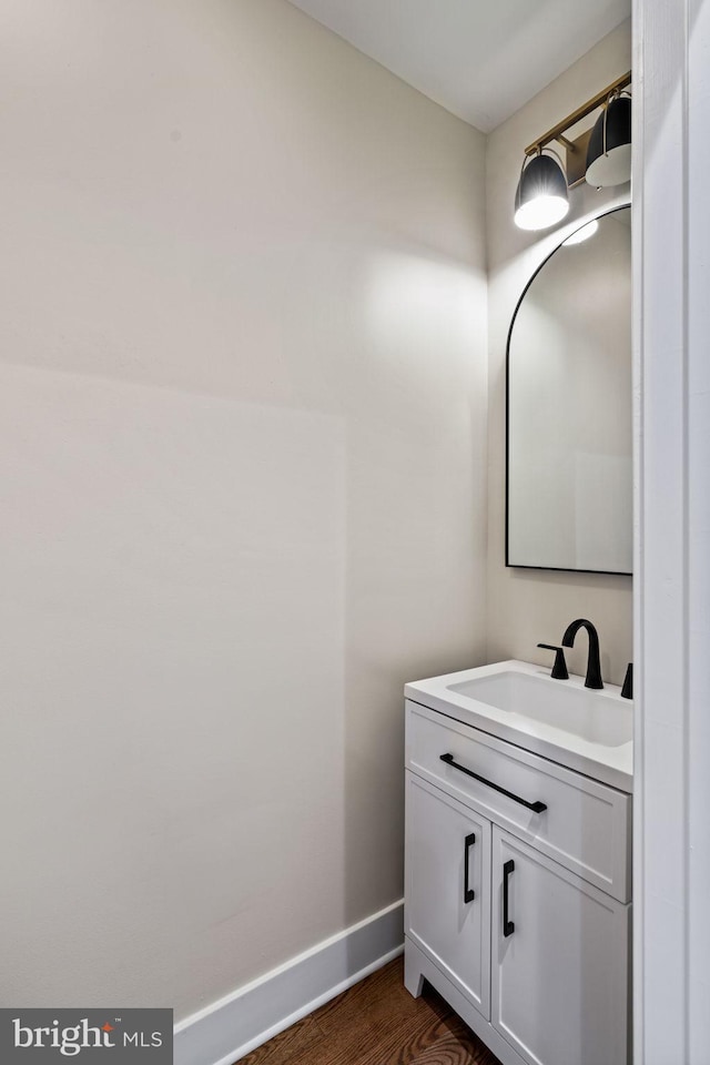 bathroom featuring hardwood / wood-style flooring and vanity