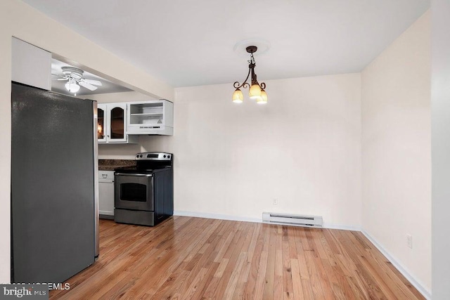 kitchen with white cabinets, hanging light fixtures, baseboard heating, light hardwood / wood-style floors, and stainless steel appliances