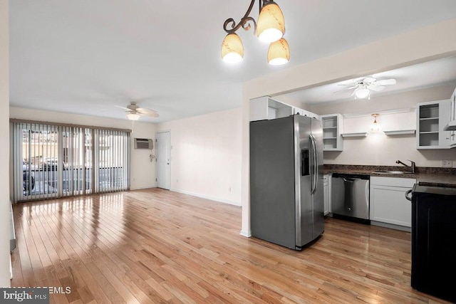 kitchen with white cabinetry, pendant lighting, ceiling fan, and stainless steel appliances