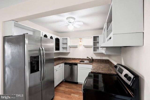 kitchen with white cabinets, sink, dark hardwood / wood-style floors, ceiling fan, and stainless steel appliances