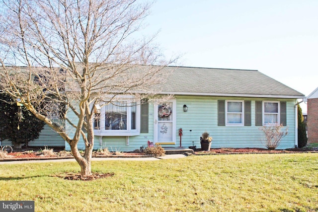 view of front facade with a front yard